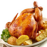 46728183 – roasted chicken with potatoes on white plate